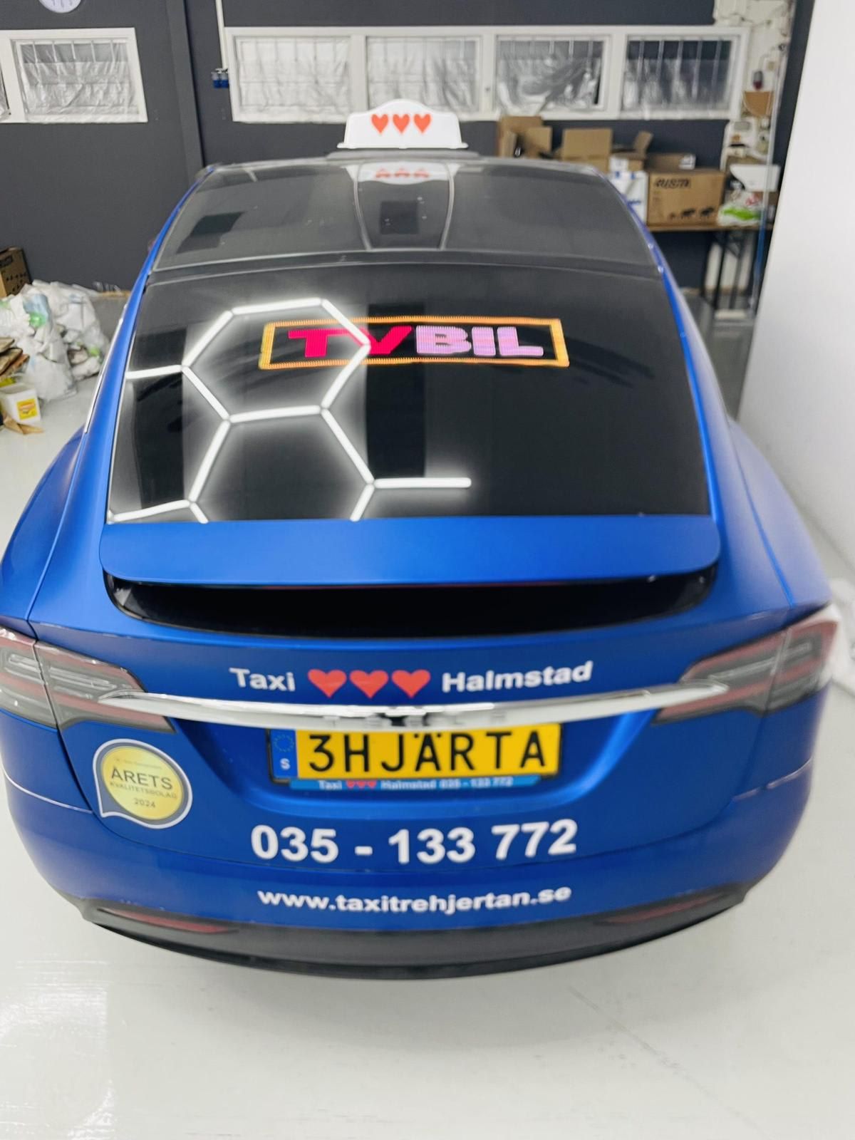 Taxi Halmstad #1 translates to "TVBIL Taxi Halmstad #1" in English. The phrase is likely a brand name or slogan, so it retains its original form.